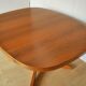 Baumann oval walnut table with extension cords