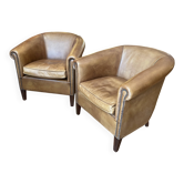 pair of camel leather club armchairs