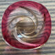 Empty pocket in pink tinted glass