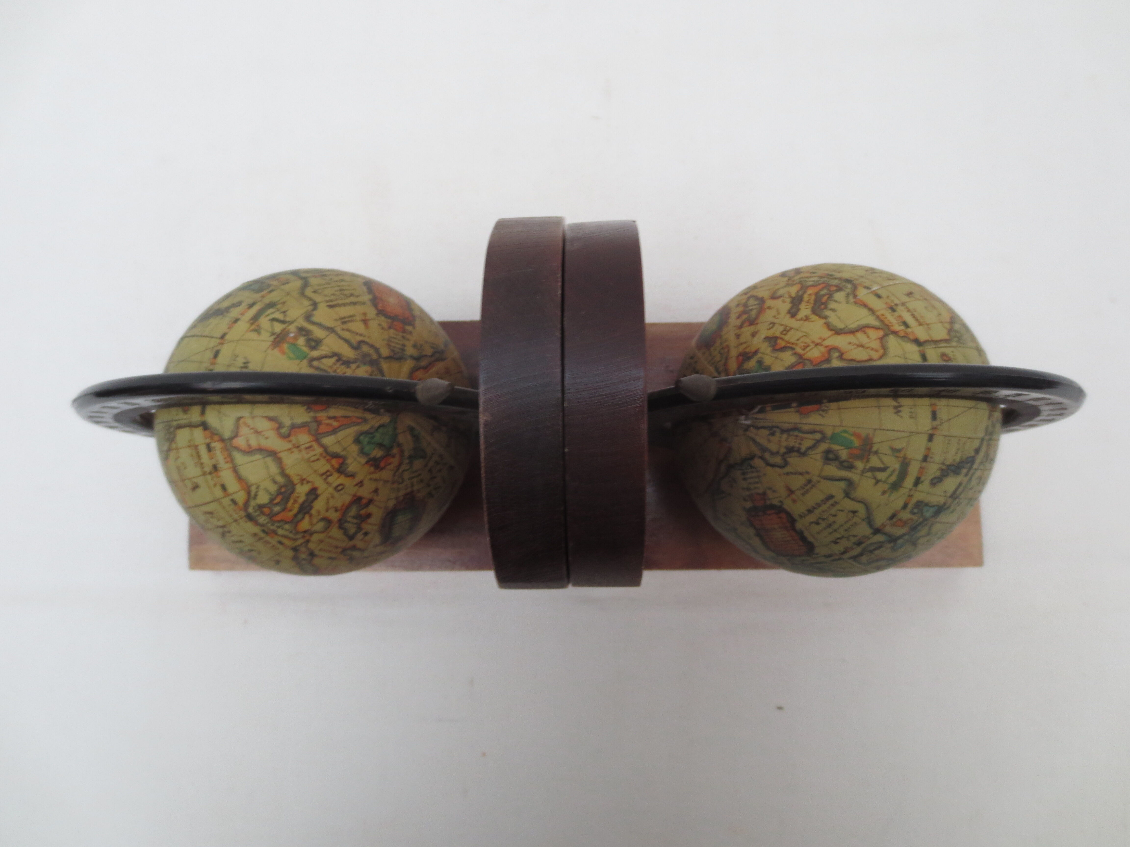 Old pair of greenhouse books in solid wood and world map