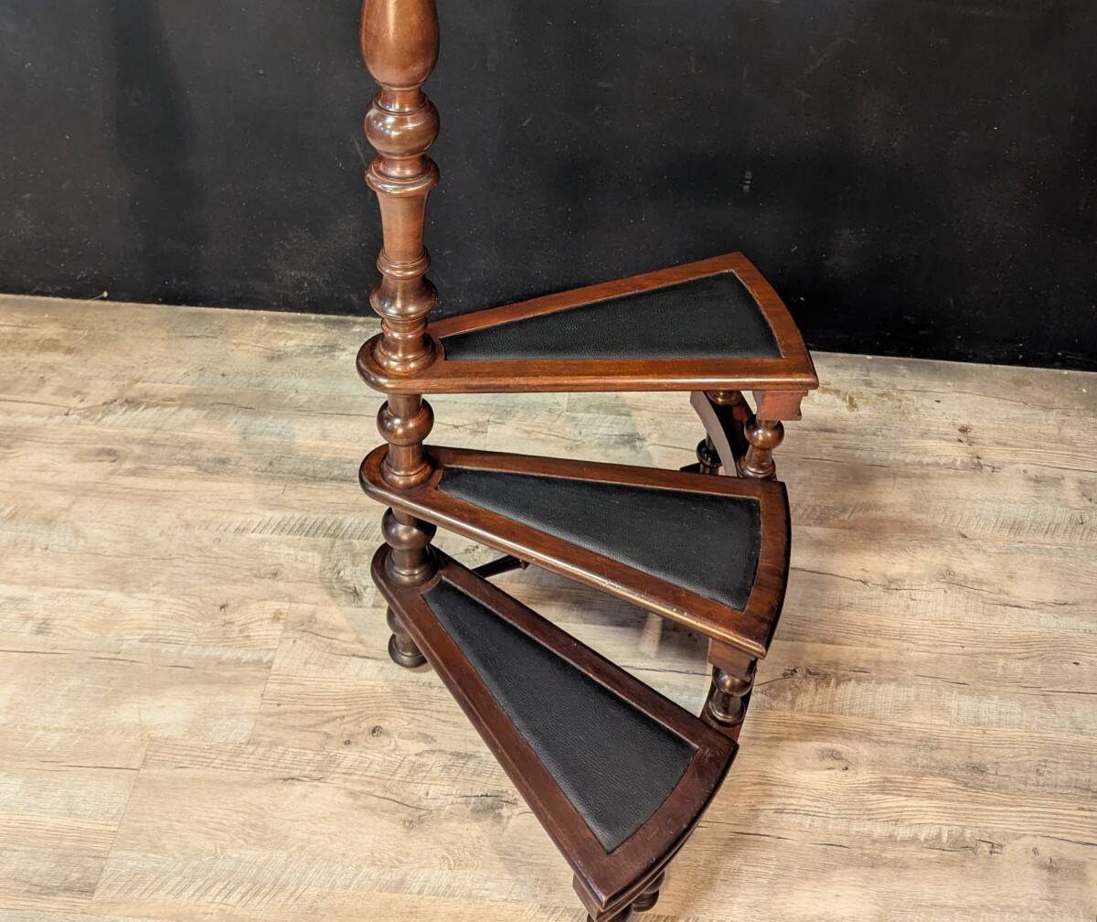 Spiral library staircase in mahogany