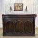 Early 20th-century oak bar counter with period zinc and tin cladding.