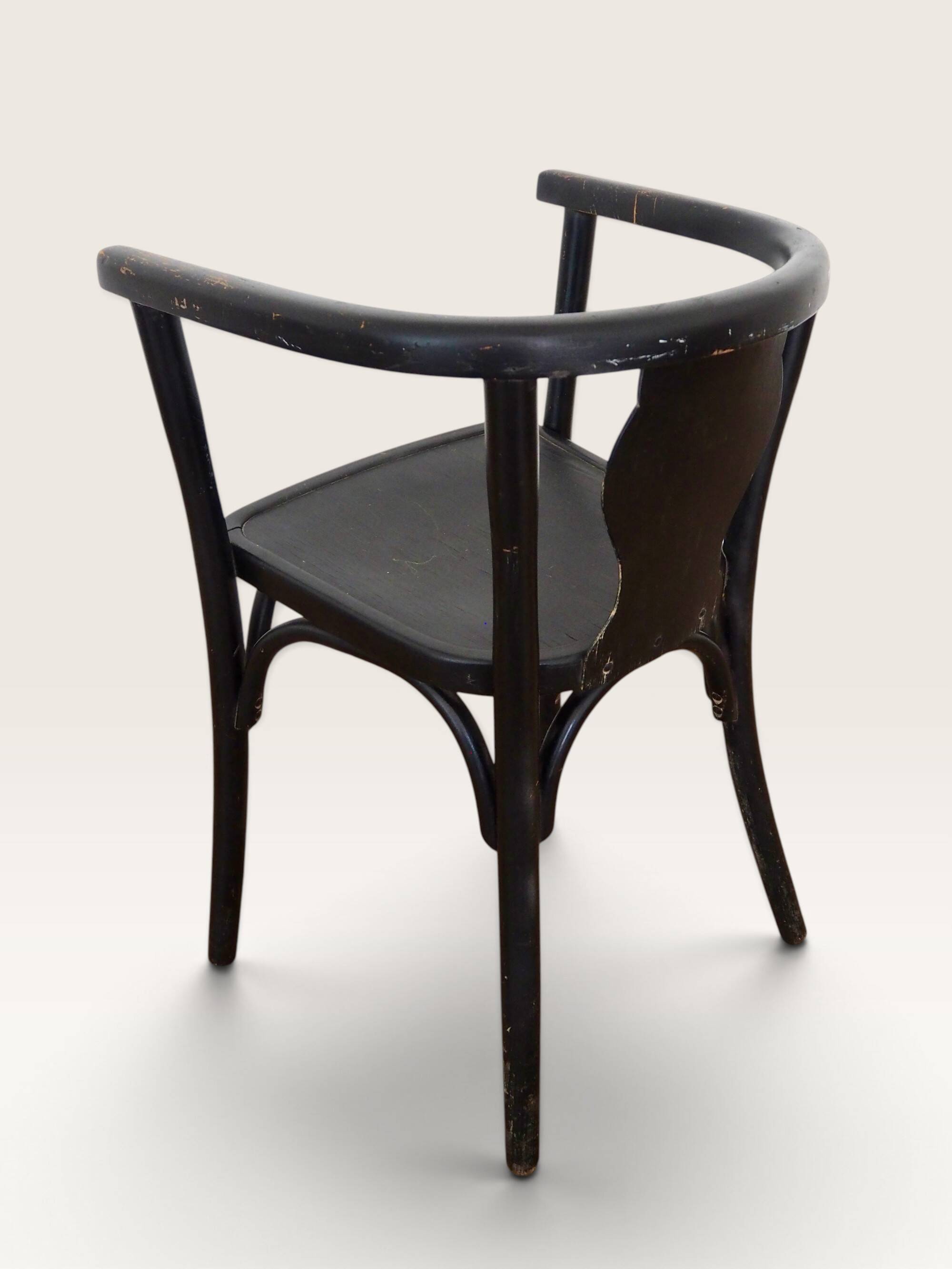Curved black lacquered wooden armchair in Thonet style