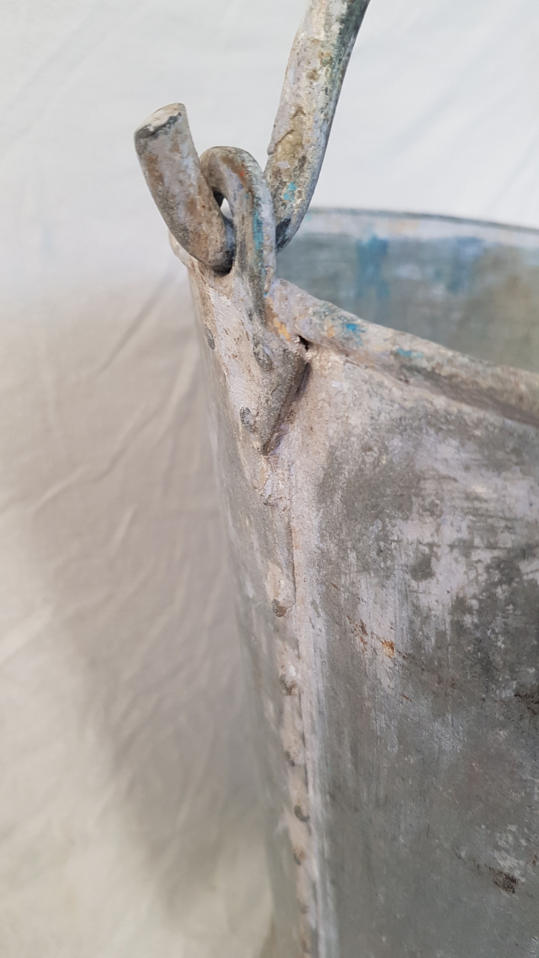 Old bucket with thick zinc handle