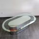 Vintage coffee table with glass and chrome metal.