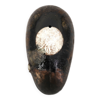 Wall sculpture, stylised mask signed in ceramic.