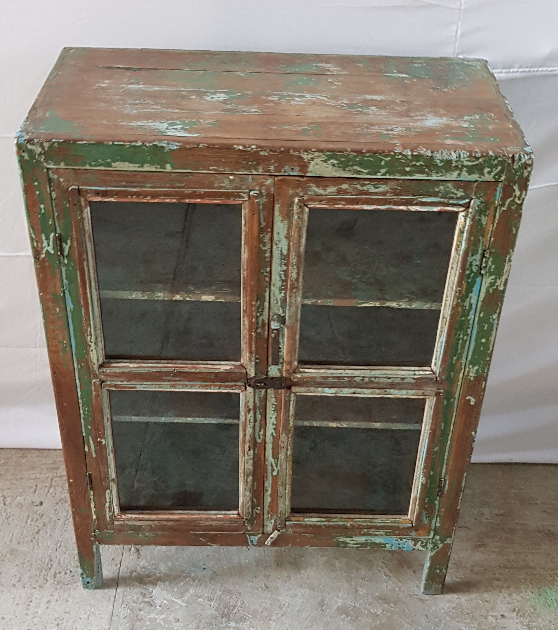 Former teak cabinet with its original green patina