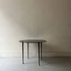 Vintage round black glass coffee table, 1950s