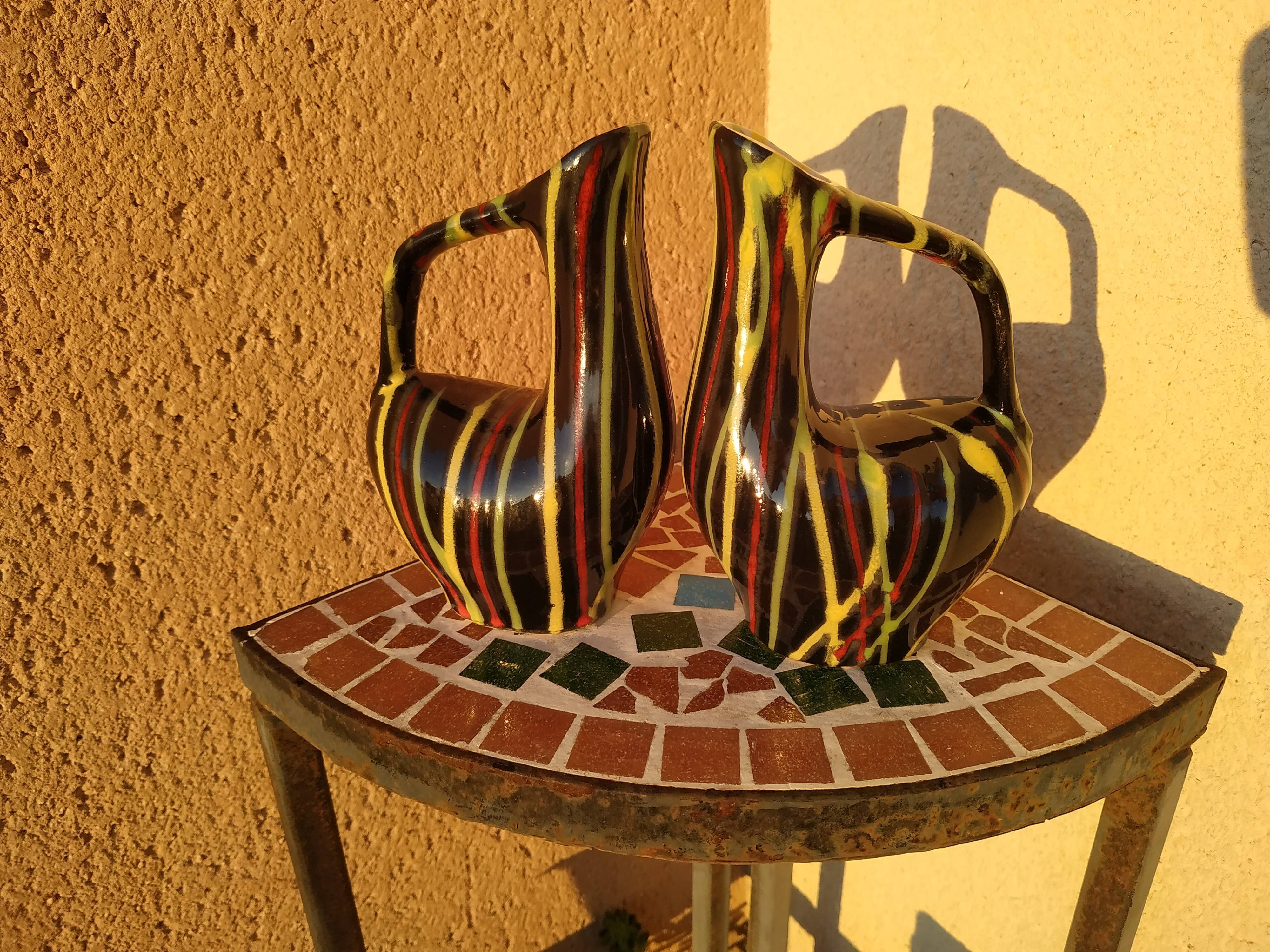 Pair of small zoomorphic pourers striped 50s
