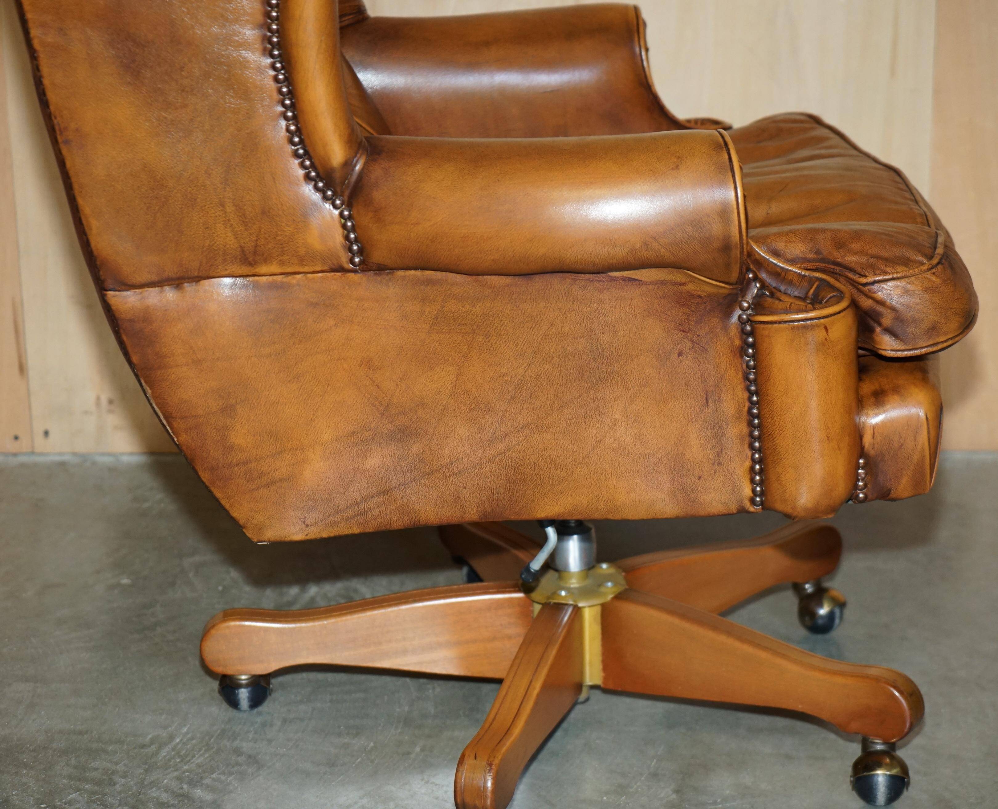 Captain's chair Chesterfield vintage leather with tufted wingback.