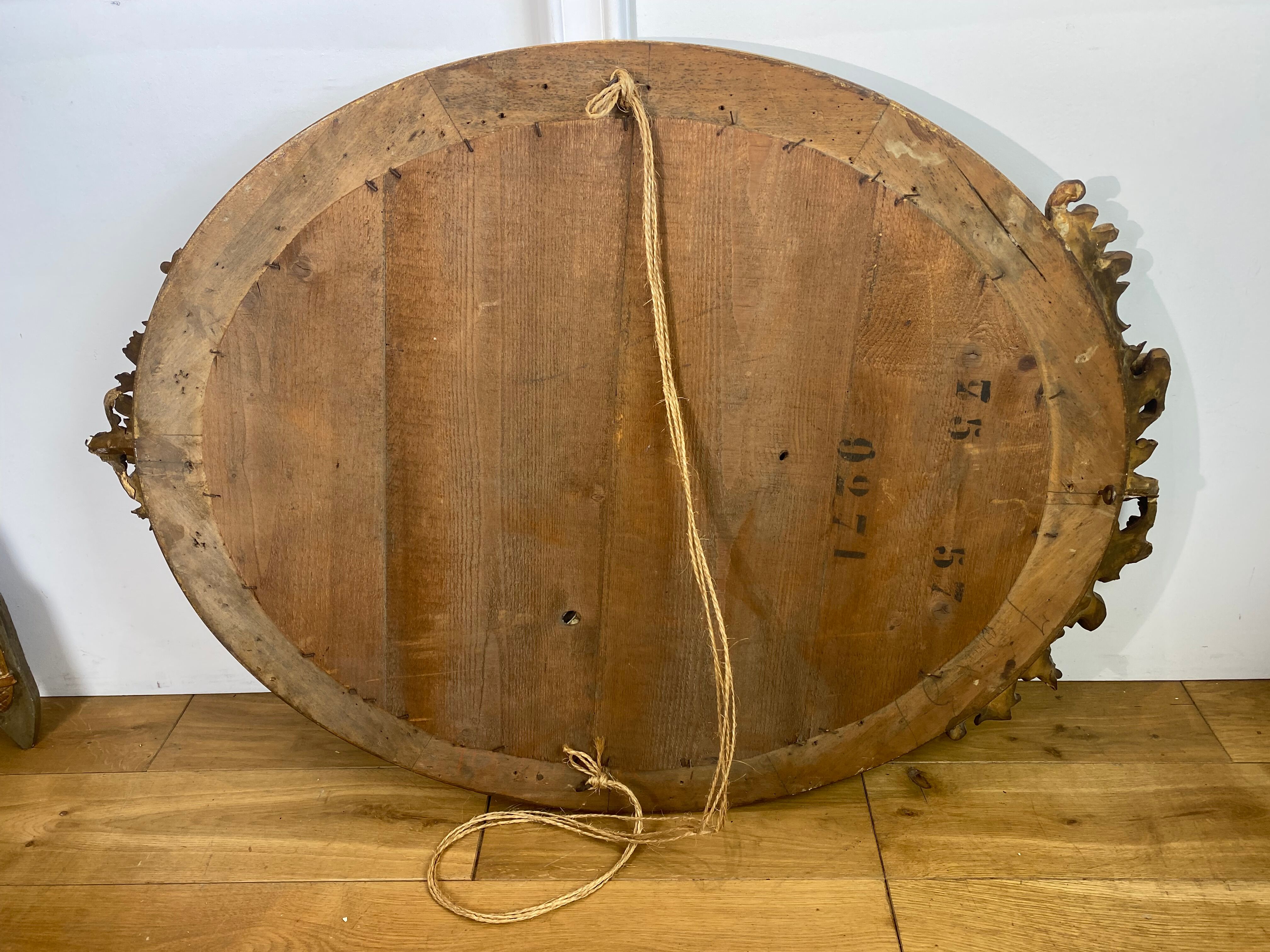 Mirror / oval ice Napoleon III period in wood and gilded stucco louis xv style