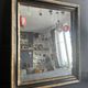 Miroir Napoléon III en bois noir et doré, XIXe siècle