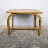 Old curved wooden children's desk.
