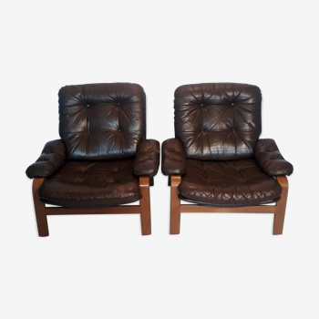 Pair of leather armchairs and curved wood
