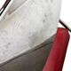Vintage folding chair in red faux leather with a chrome frame.