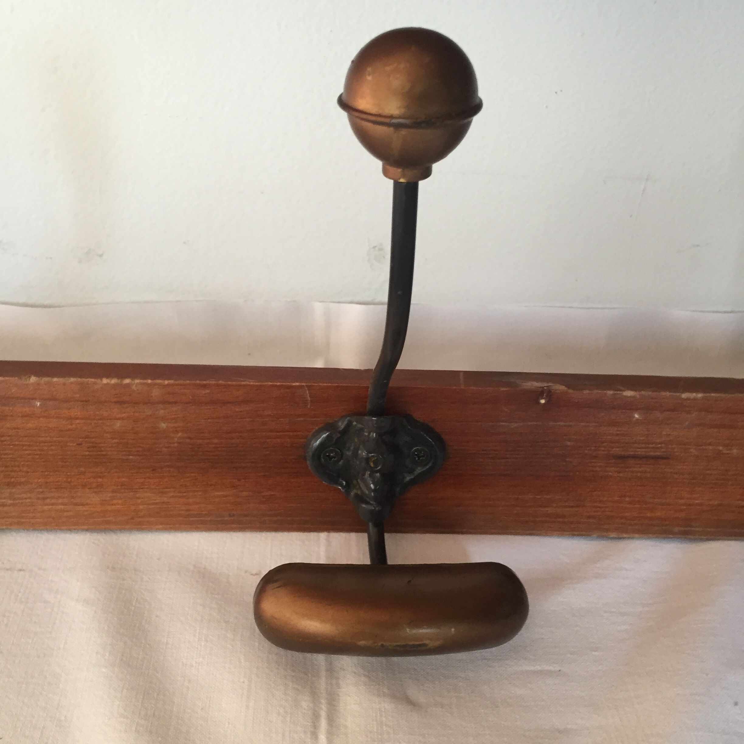 Old wood and brass coat rack
