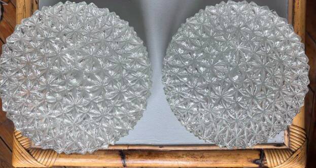 Pair of round vintage moulded glass ceiling lights.
