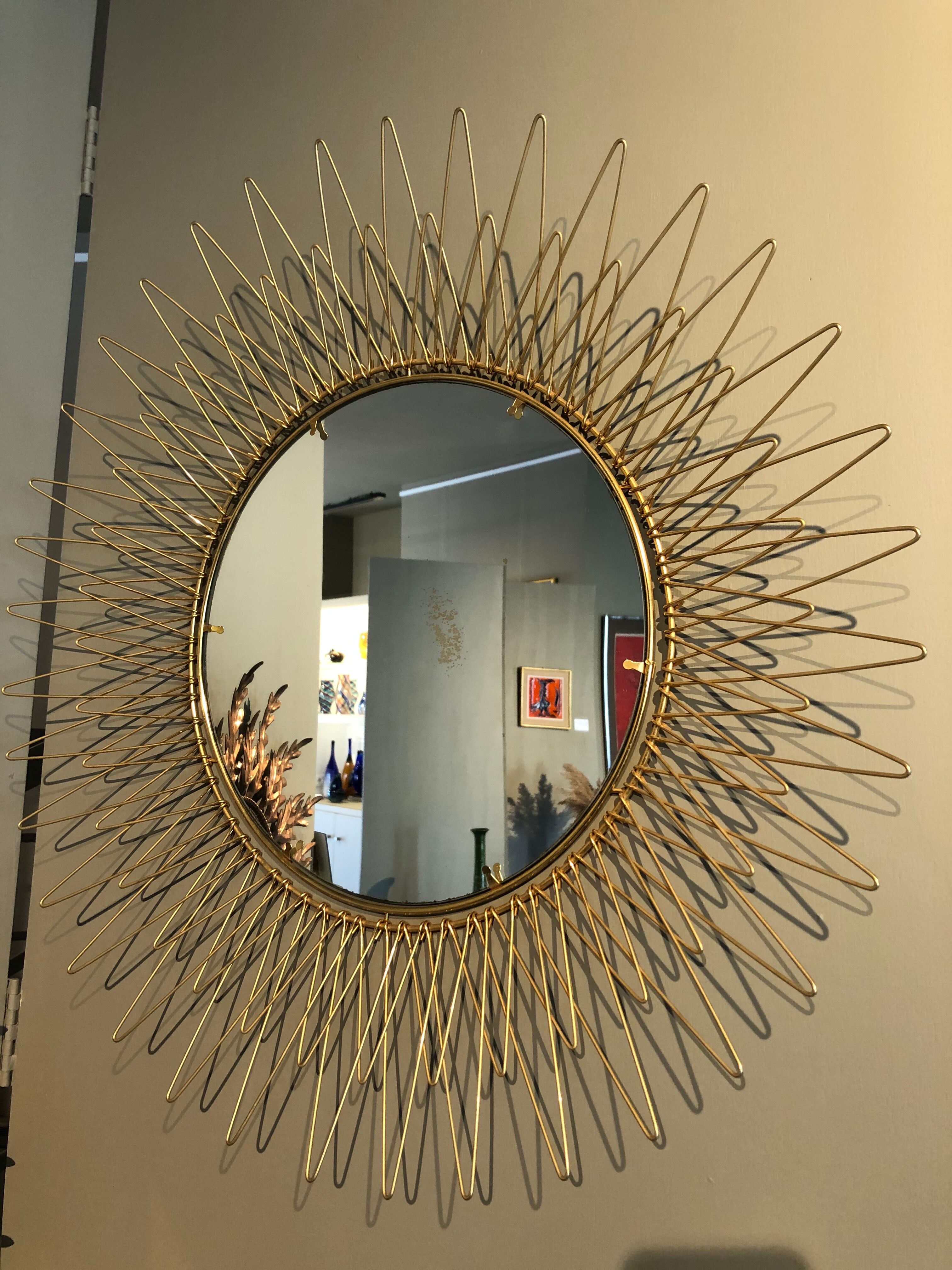 Golden brass sun mirror