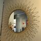 Golden brass sun mirror