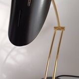 Articulated black and gold metal desk lamp