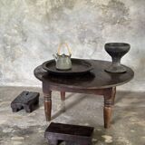 Coffee table, round antique Indonesian teak table with straight legs.