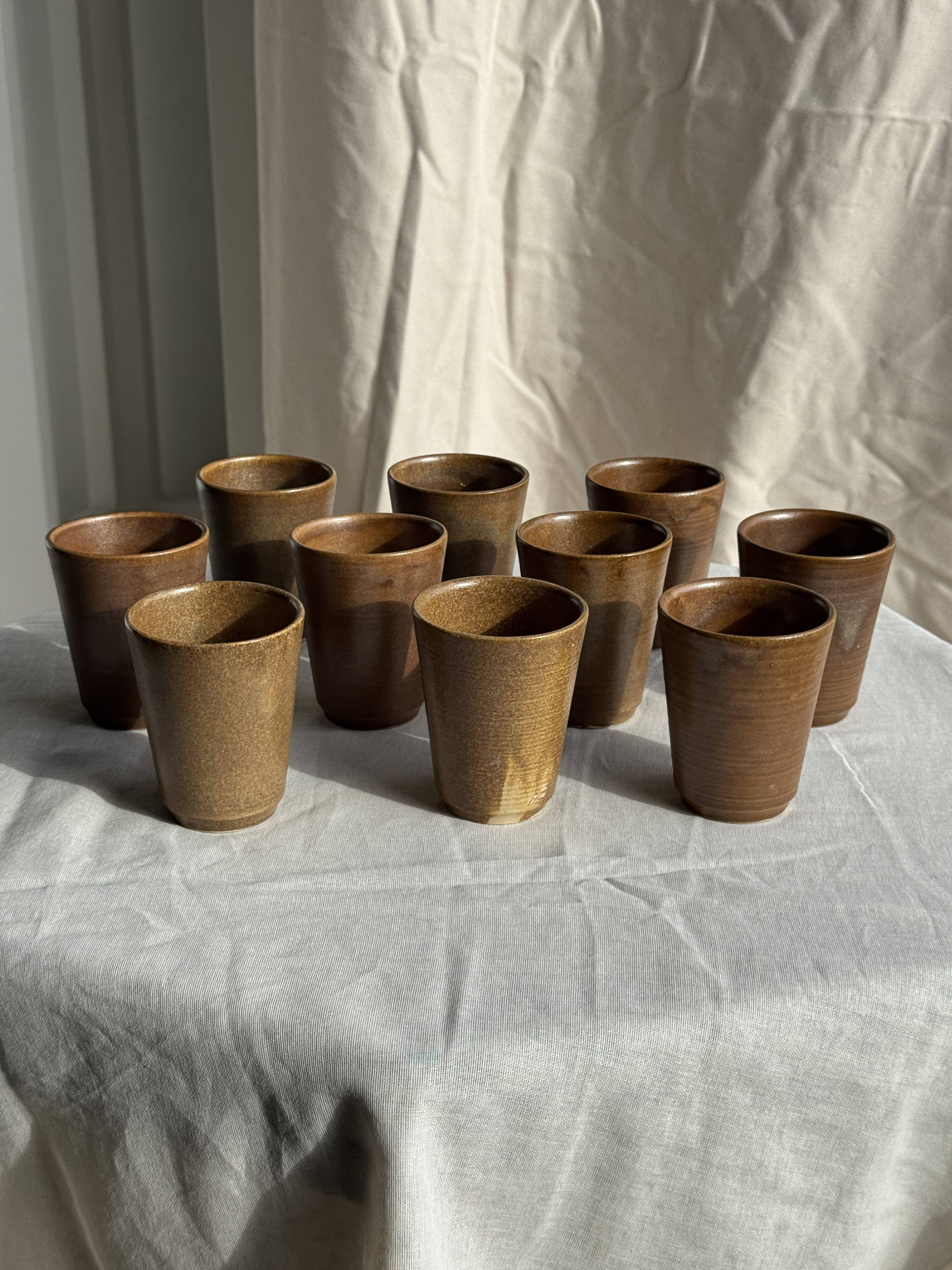 Set of 10 small stoneware mugs from Digoin.