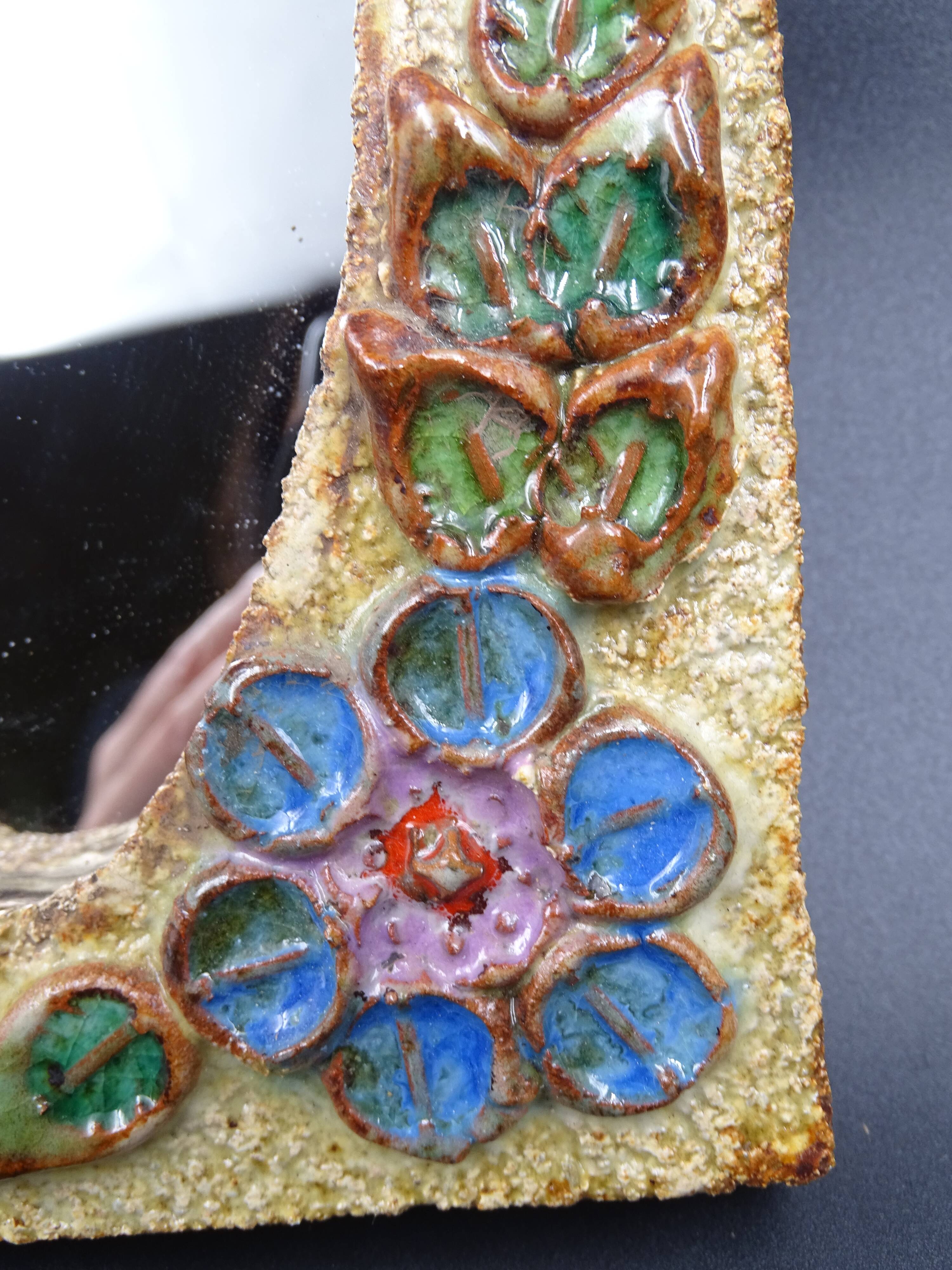 Flower-decorated sandstone mirror, circa 1970