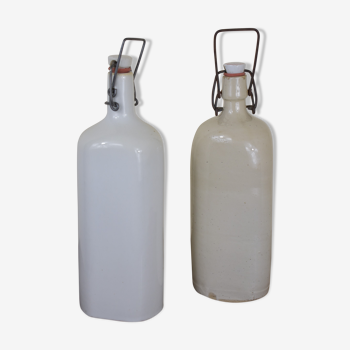 pair of white ceramic bottle