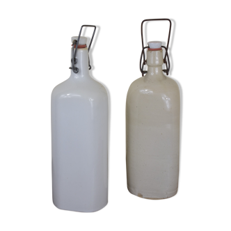 pair of white ceramic bottle