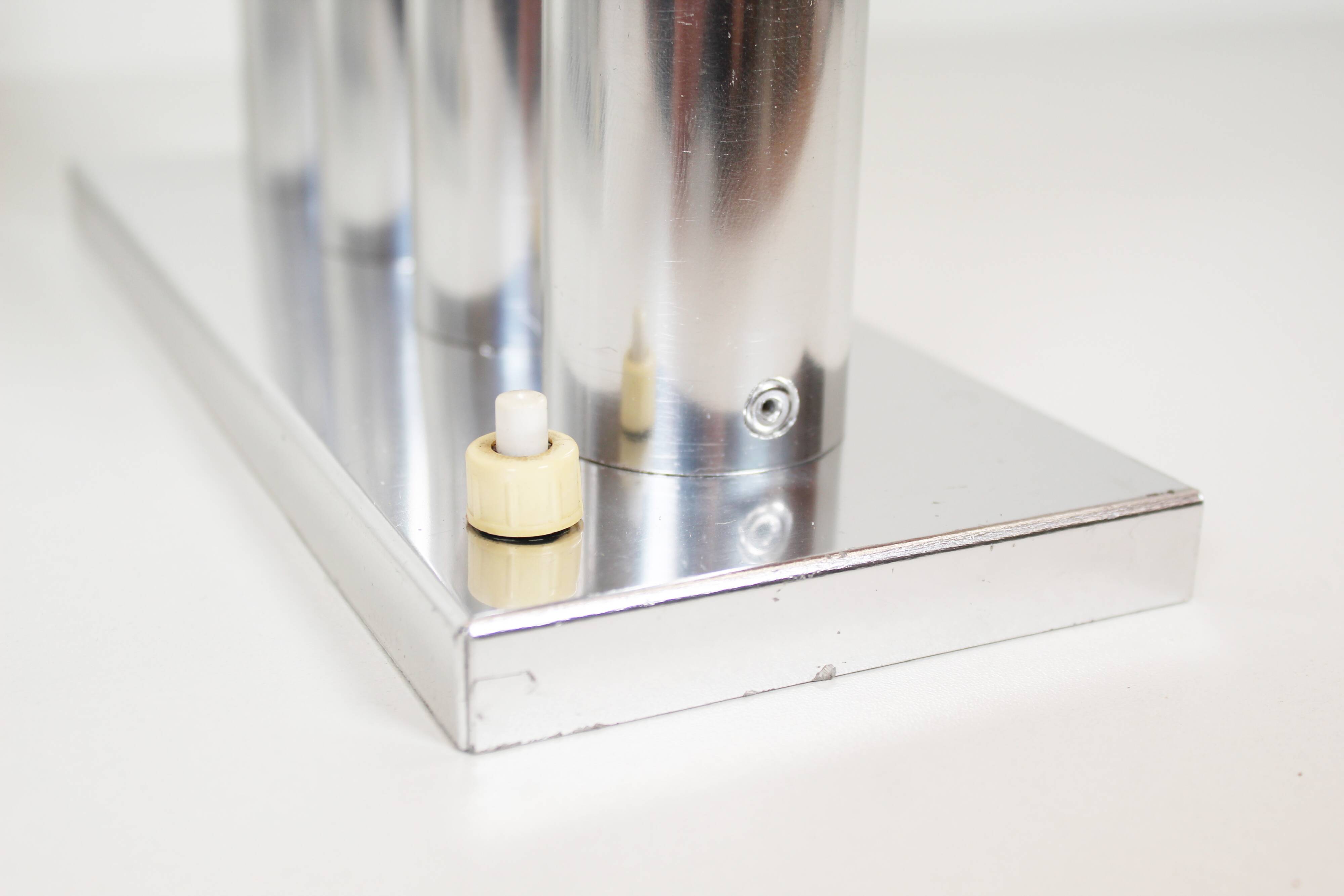 Pair of polished wall lamps by Gaetano Sciolari