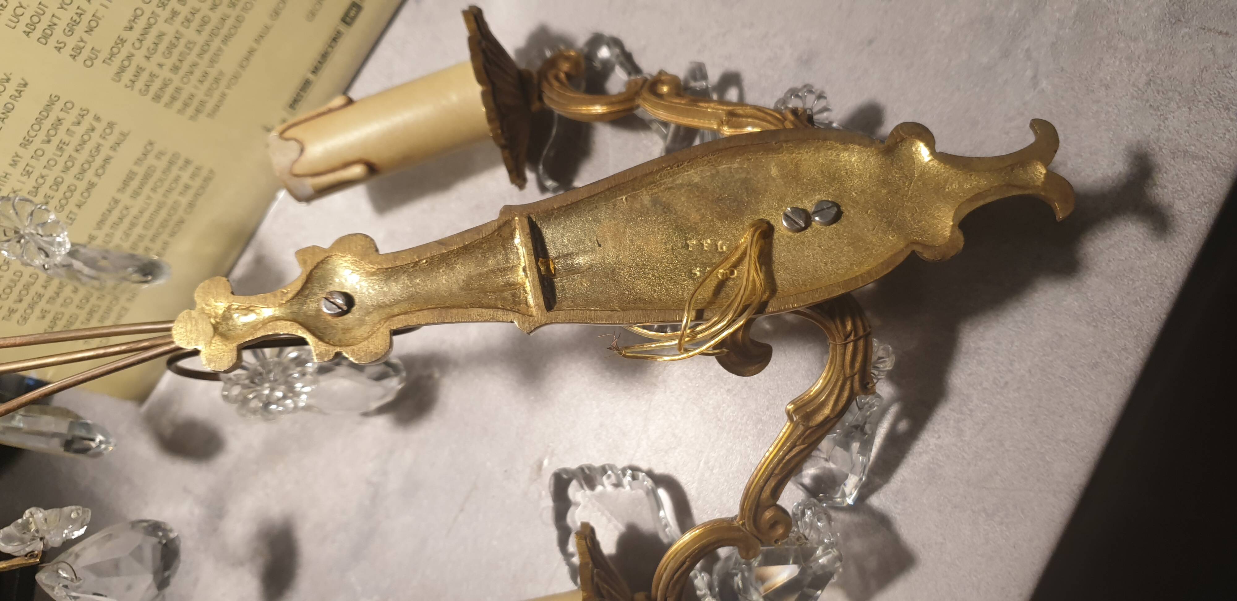 1 crystal prism wall light with 2 lights. Brass frame