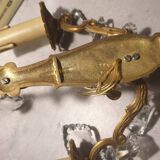 1 crystal prism wall light with 2 lights. Brass frame