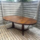 Extendable oval table Baumann, for up to 12 place settings.