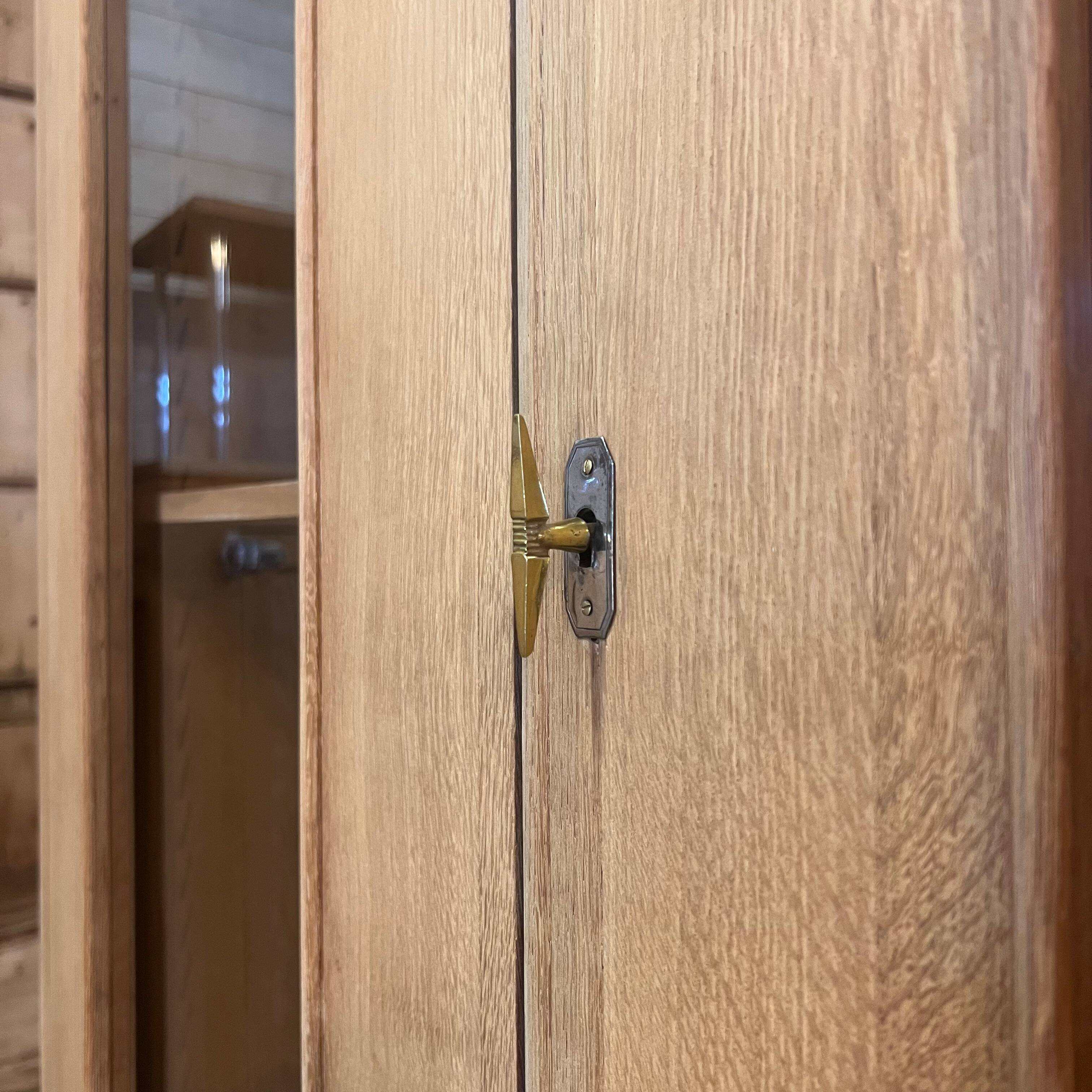 Glass-fronted school cabinet in raw oak