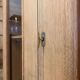 Glass-fronted school cabinet in raw oak