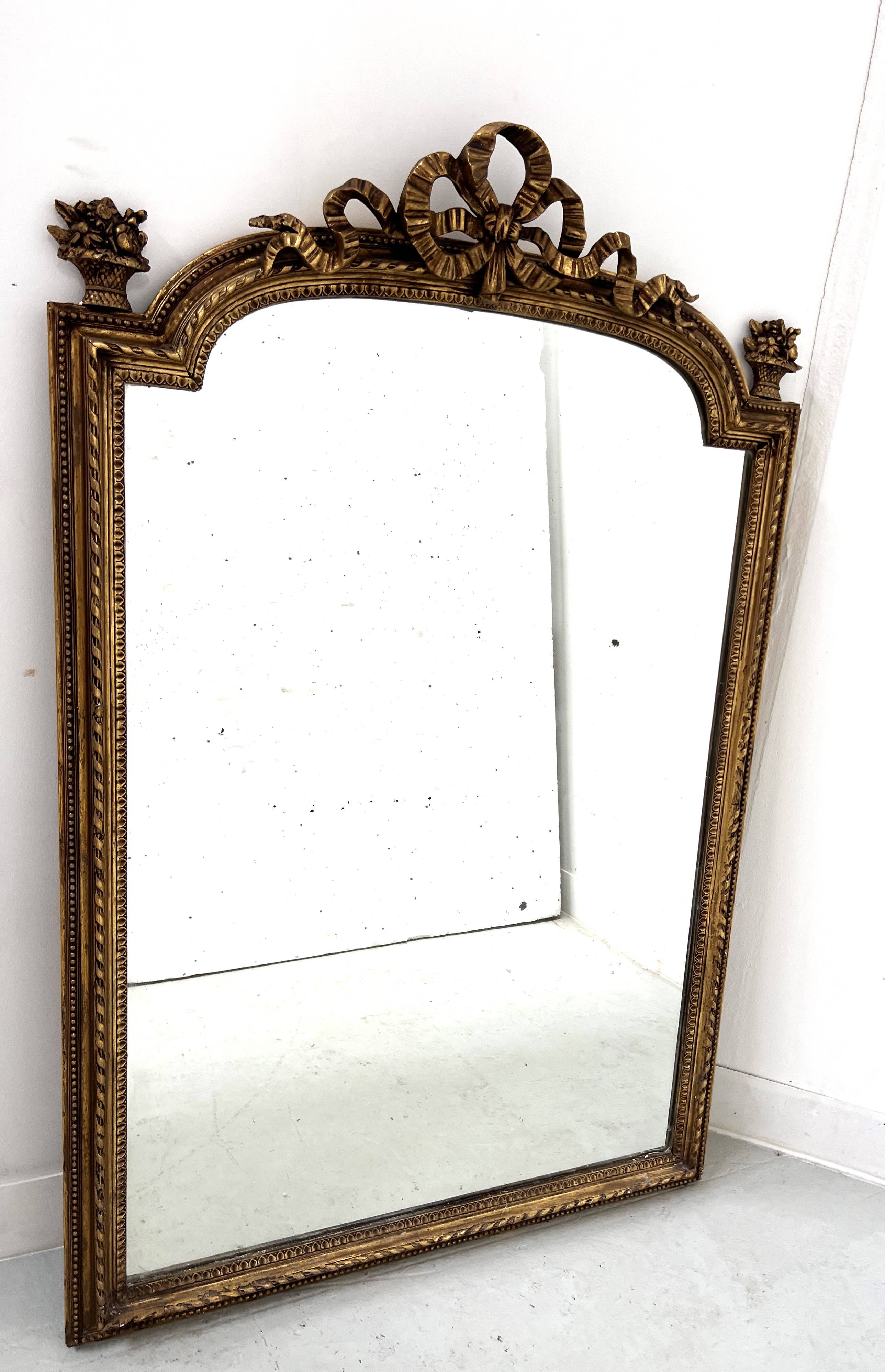 Louis XVI style mirror in wood and gilded stucco, 19th century