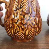 Set of 2 vintage caramel-colored slip mugs with flower pattern