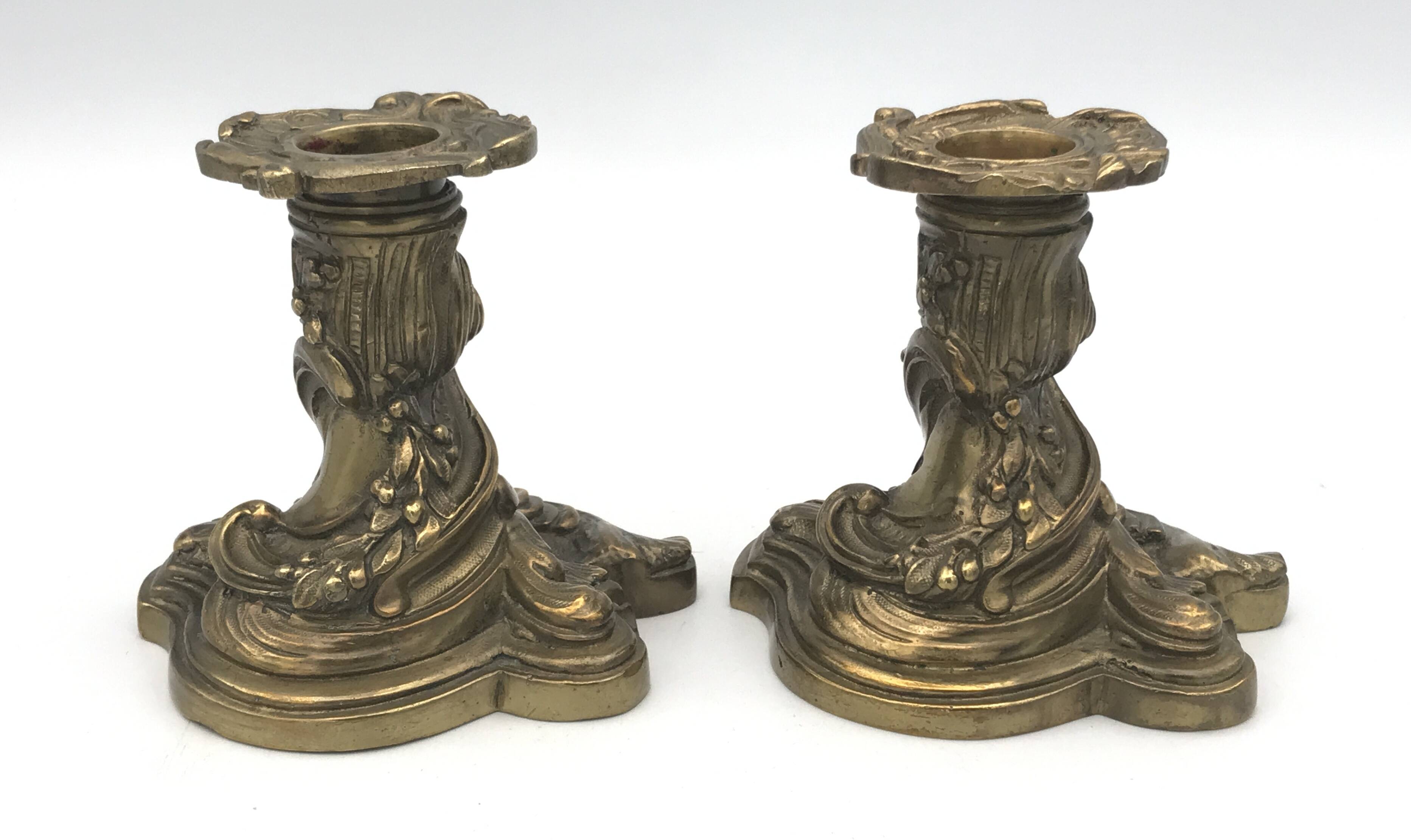 Pair of gilded bronze candlesticks with twisted decor and floral garlands, louis xv style