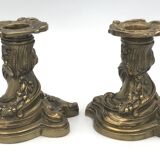 Pair of gilded bronze candlesticks with twisted decor and floral garlands, louis xv style