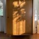 Large vintage Scandinavian wardrobe with two sliding doors.