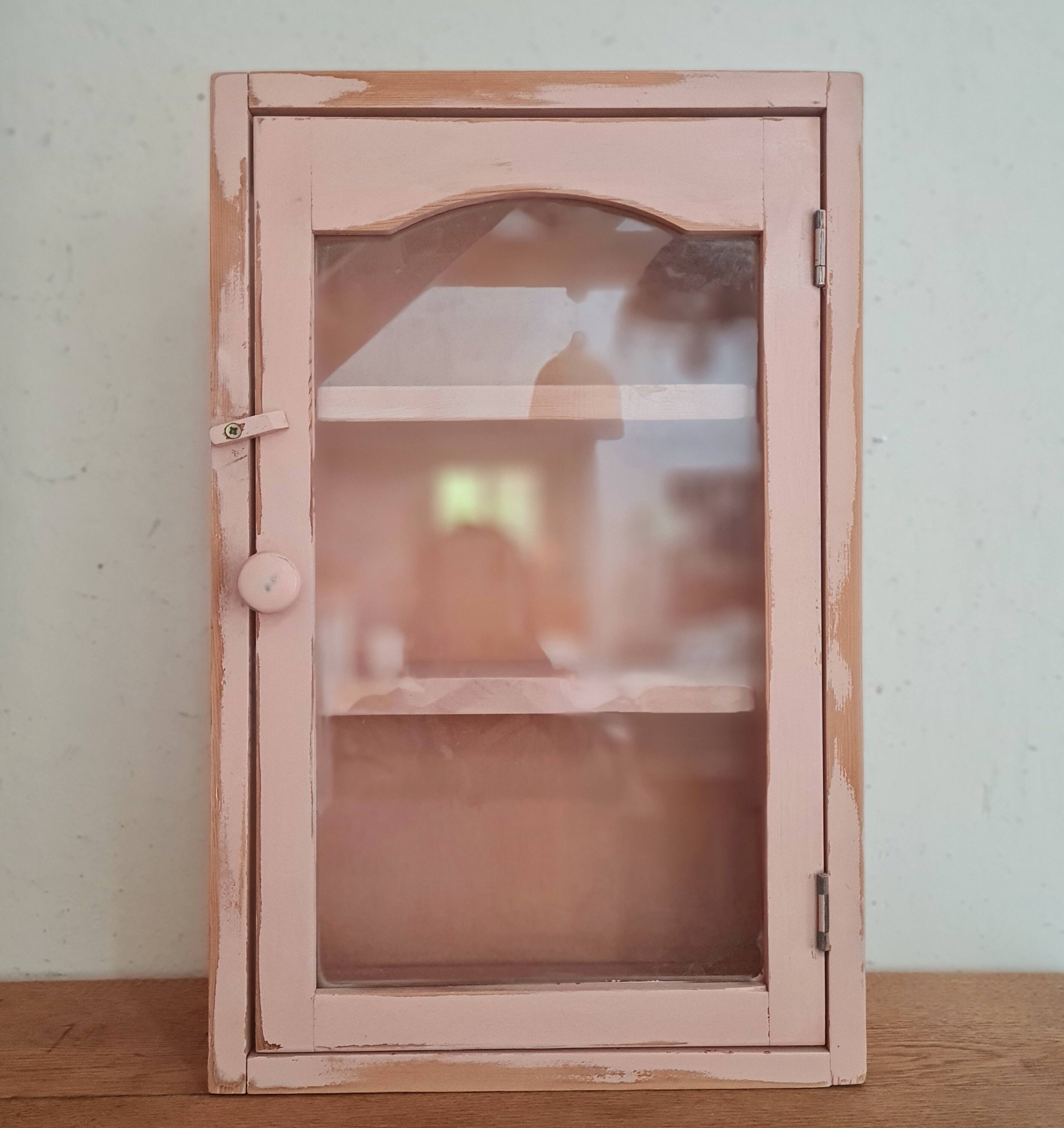 Medicine cabinet in patinated pink wood