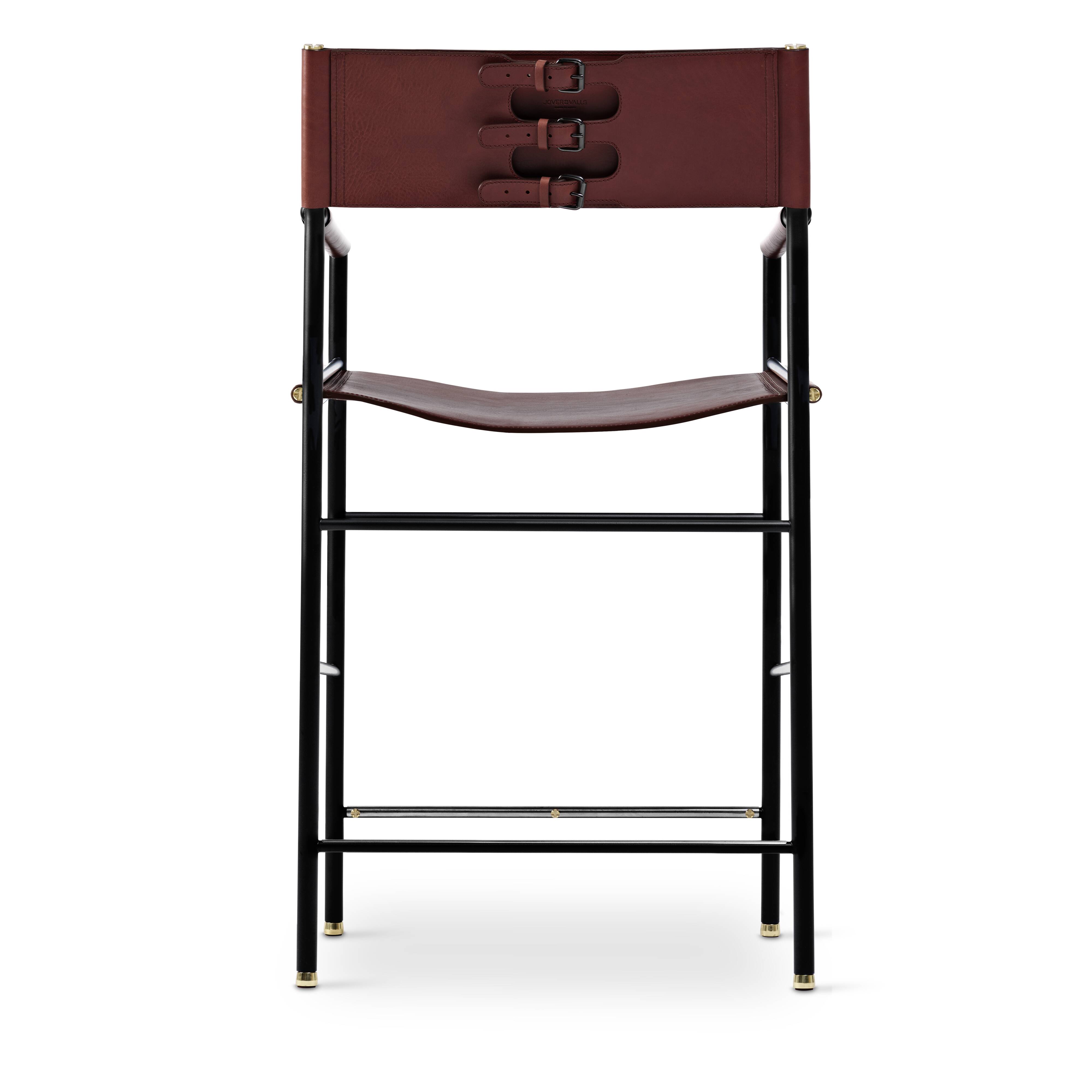 By contemporary classic bar stool with cognac leather backrest, black rubber, metal.