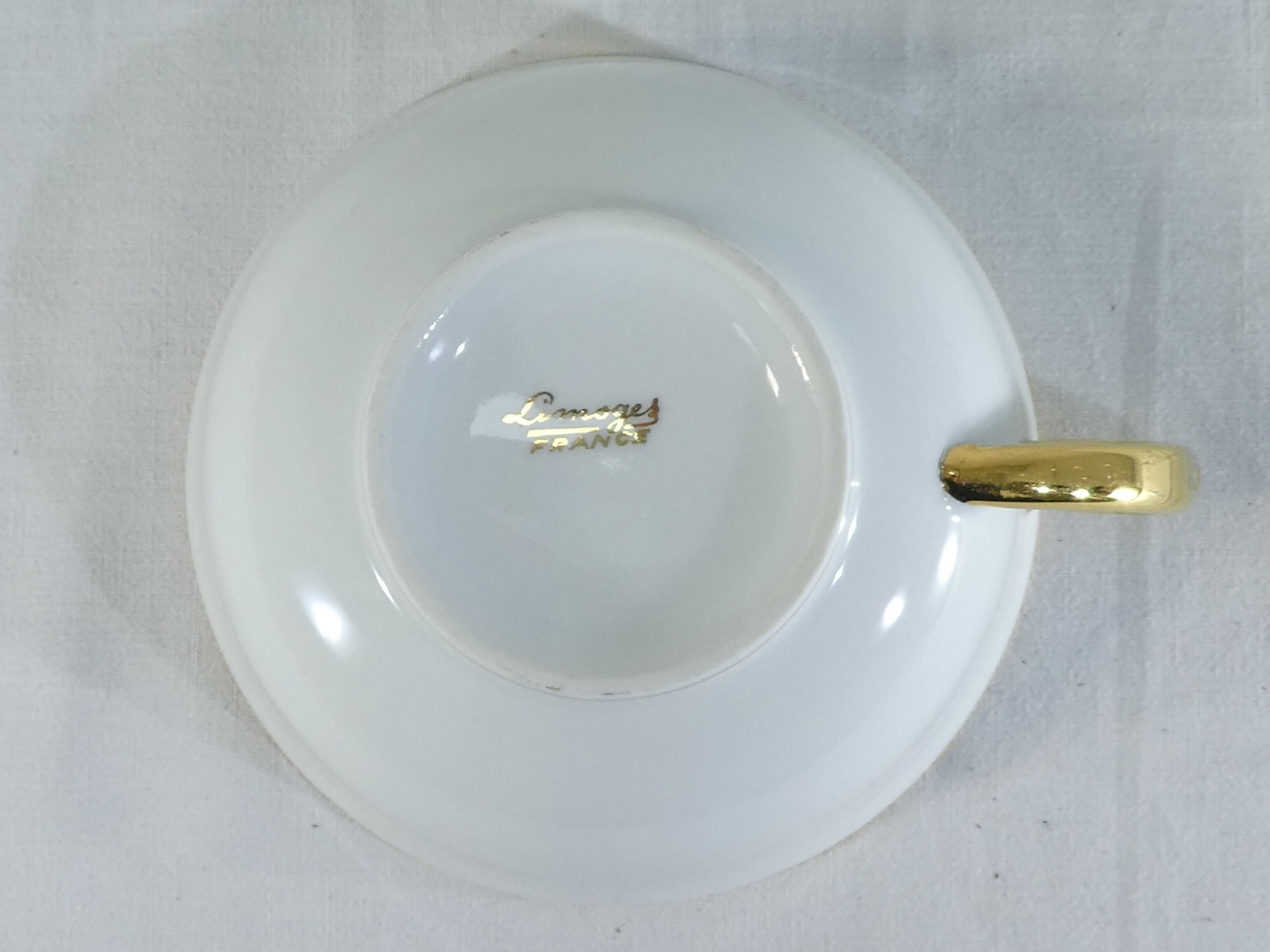 Green and gilded LIMOGES porcelain cup and cup lunch