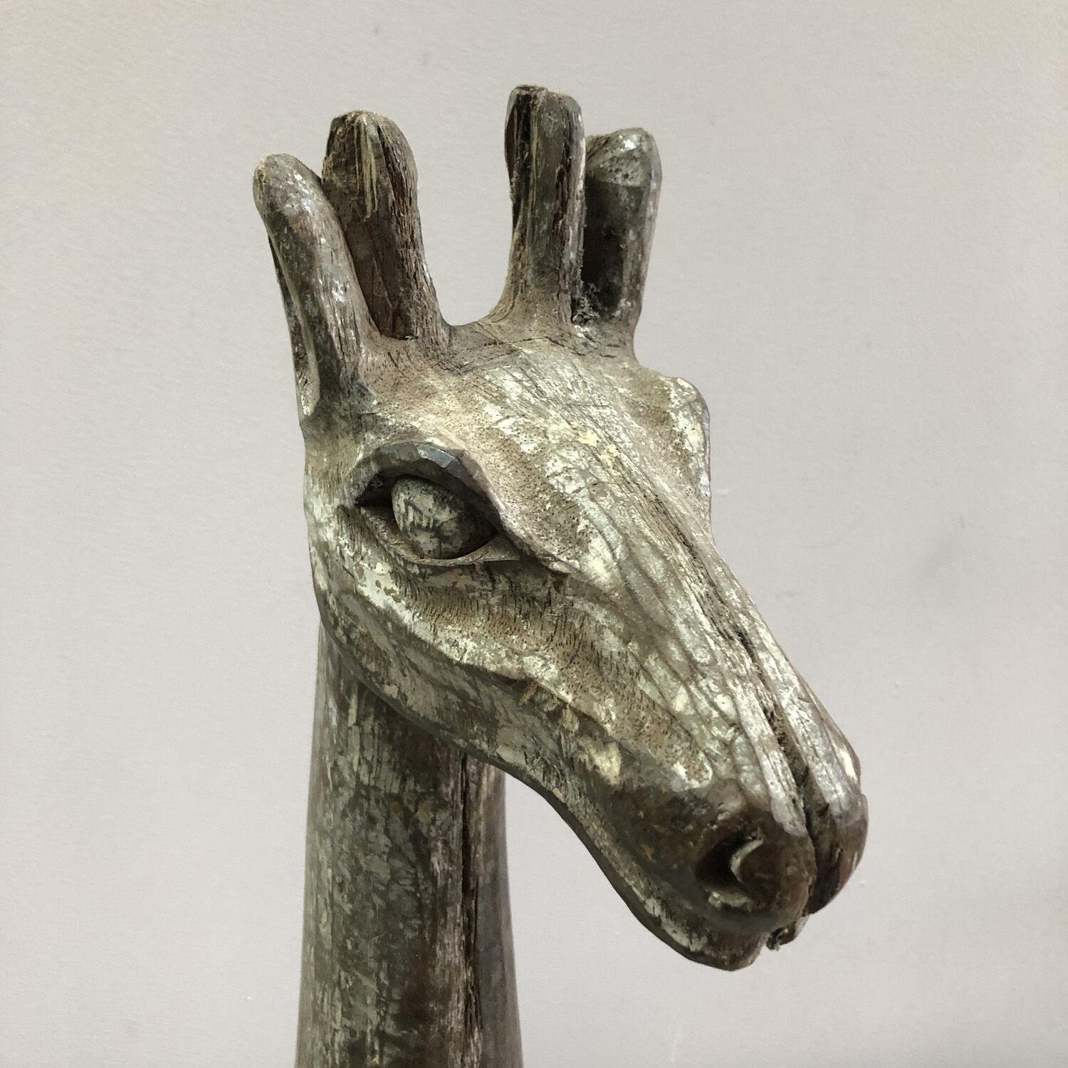 Wooden giraffe sculpture