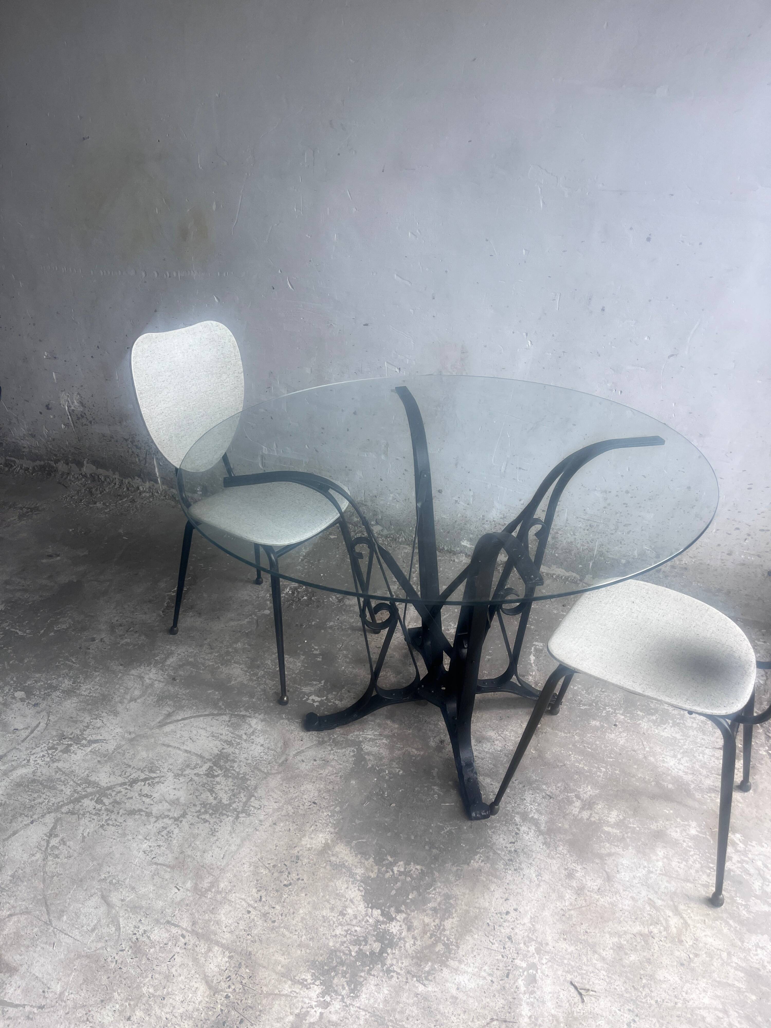Elegant pair of French dining chairs by Jacques Hitier from the 1950s.