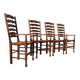 Set of 4 rustic vintage armchairs in English farmhouse style with rush seats.