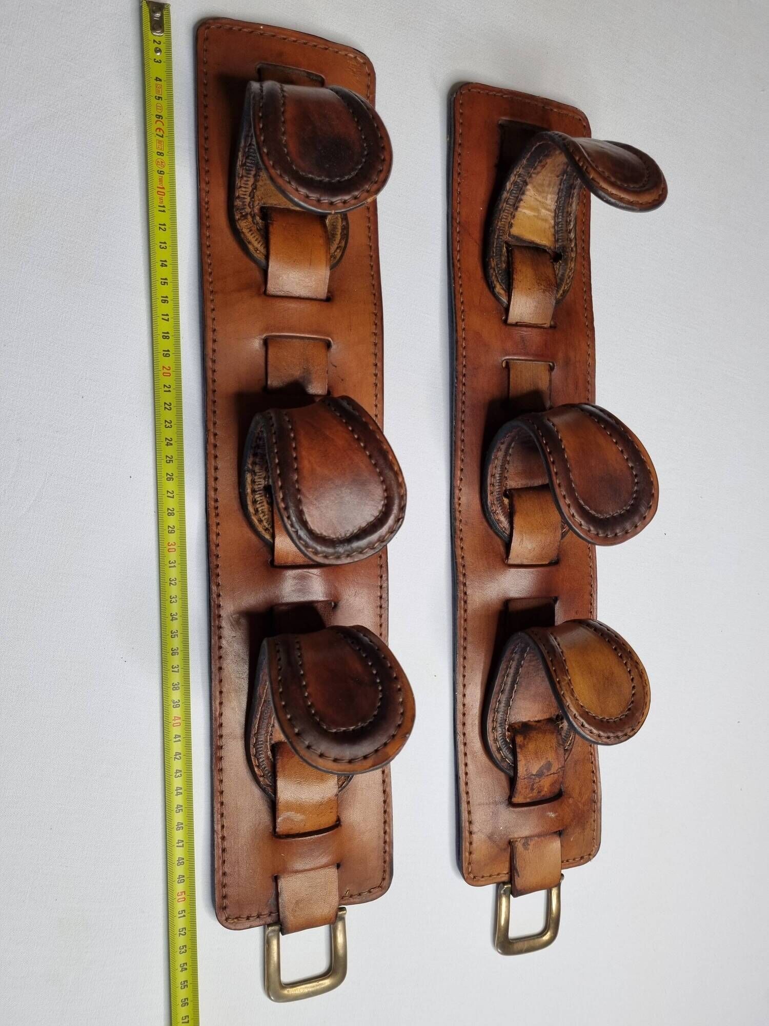 Pair of game bags in saddle leather and brass, old, 3 hooks, 57 cm