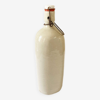 Old light gray enamelled stoneware hot water bottle