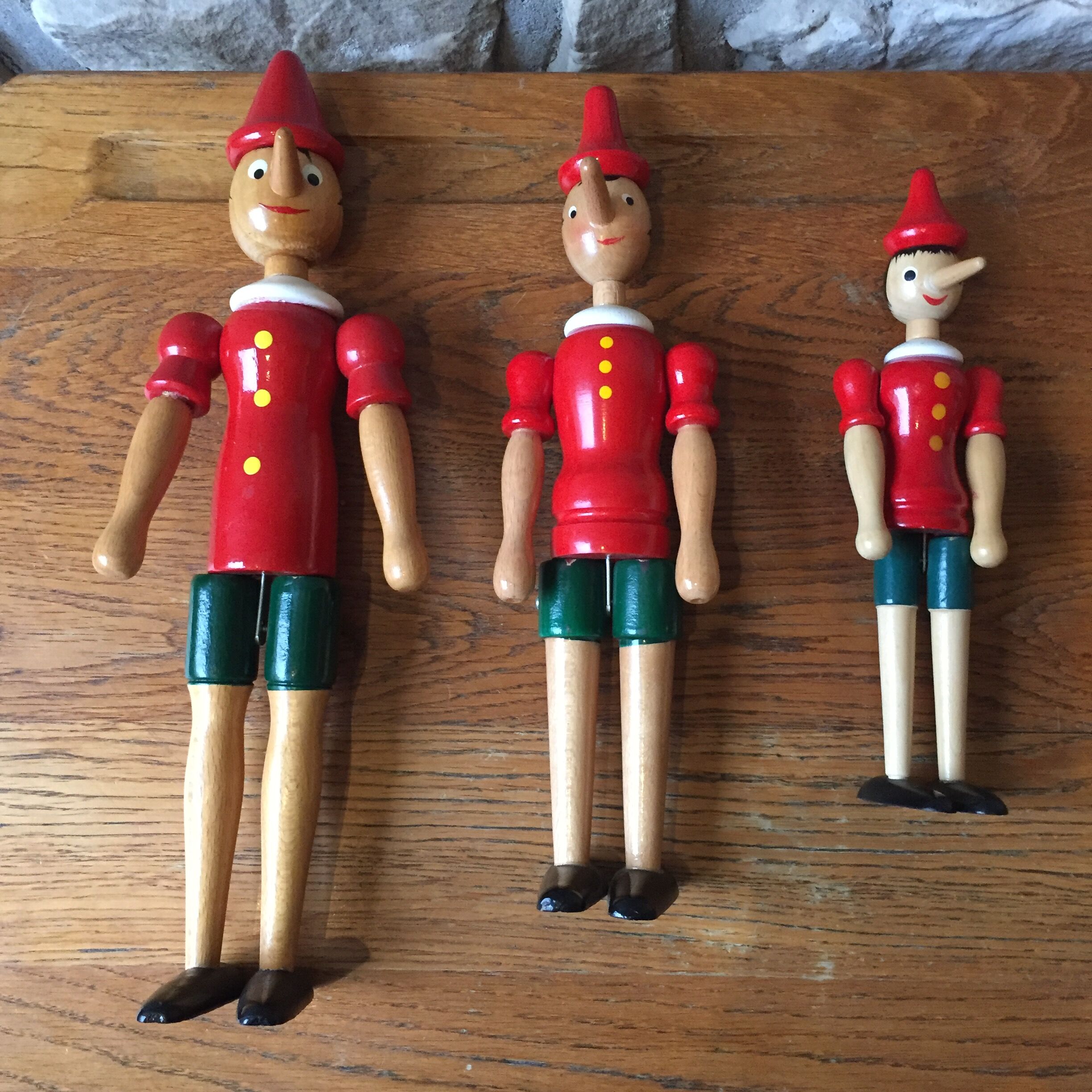 Trio of old wooden Pinocchio Made in Italy