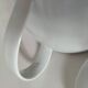 Graphic teapot in white porcelain with a minimalist design.